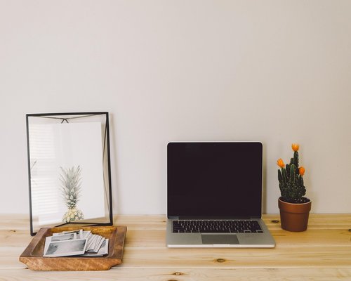 Person working comfortably from a well-lit home office setup